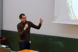 A speaker gestures at the projected slide during SmartForest 2026