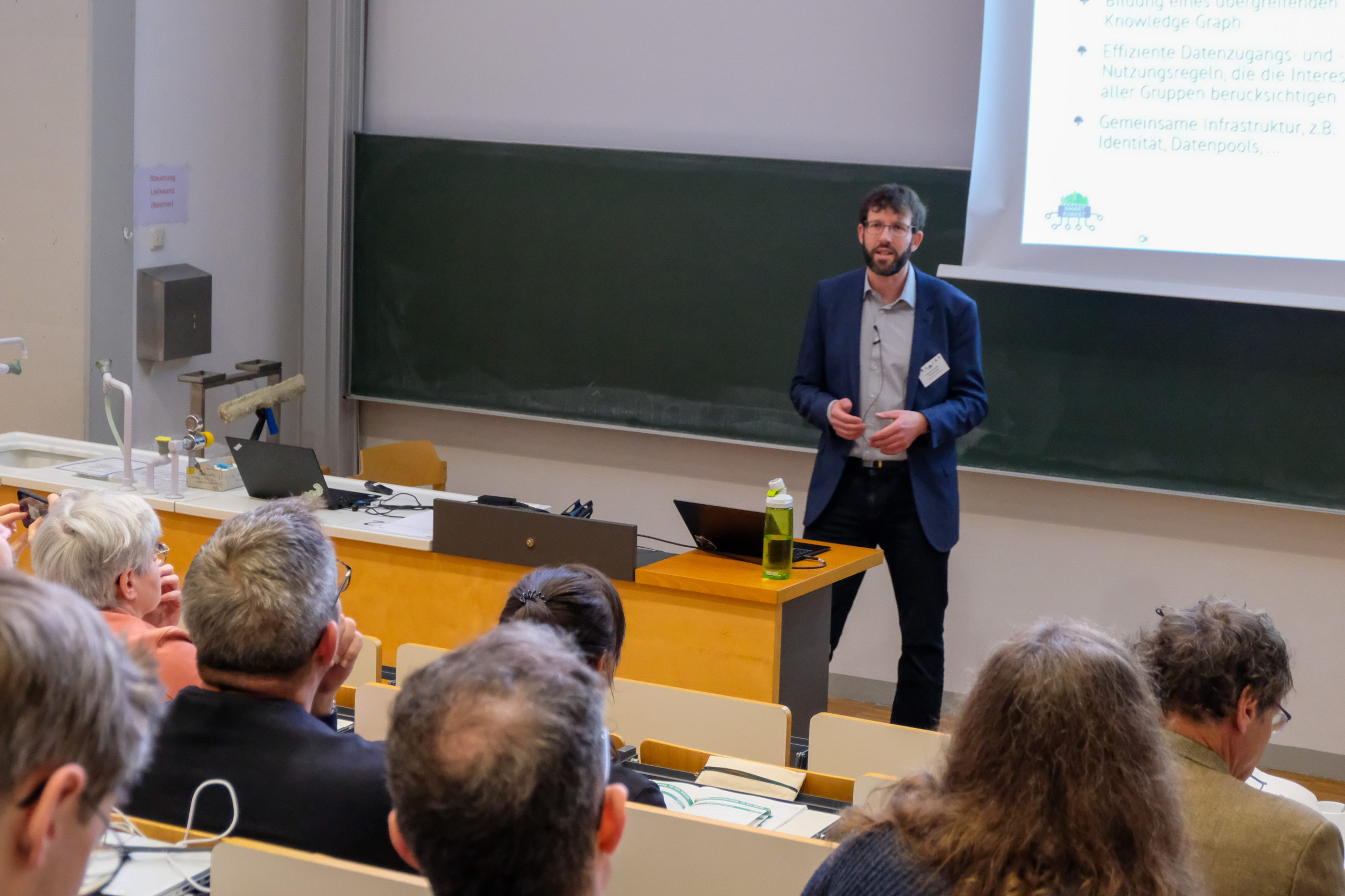 The crowd listens as wetransform CEO Thorsten Reitz presents his keynote at SmartForest 2026