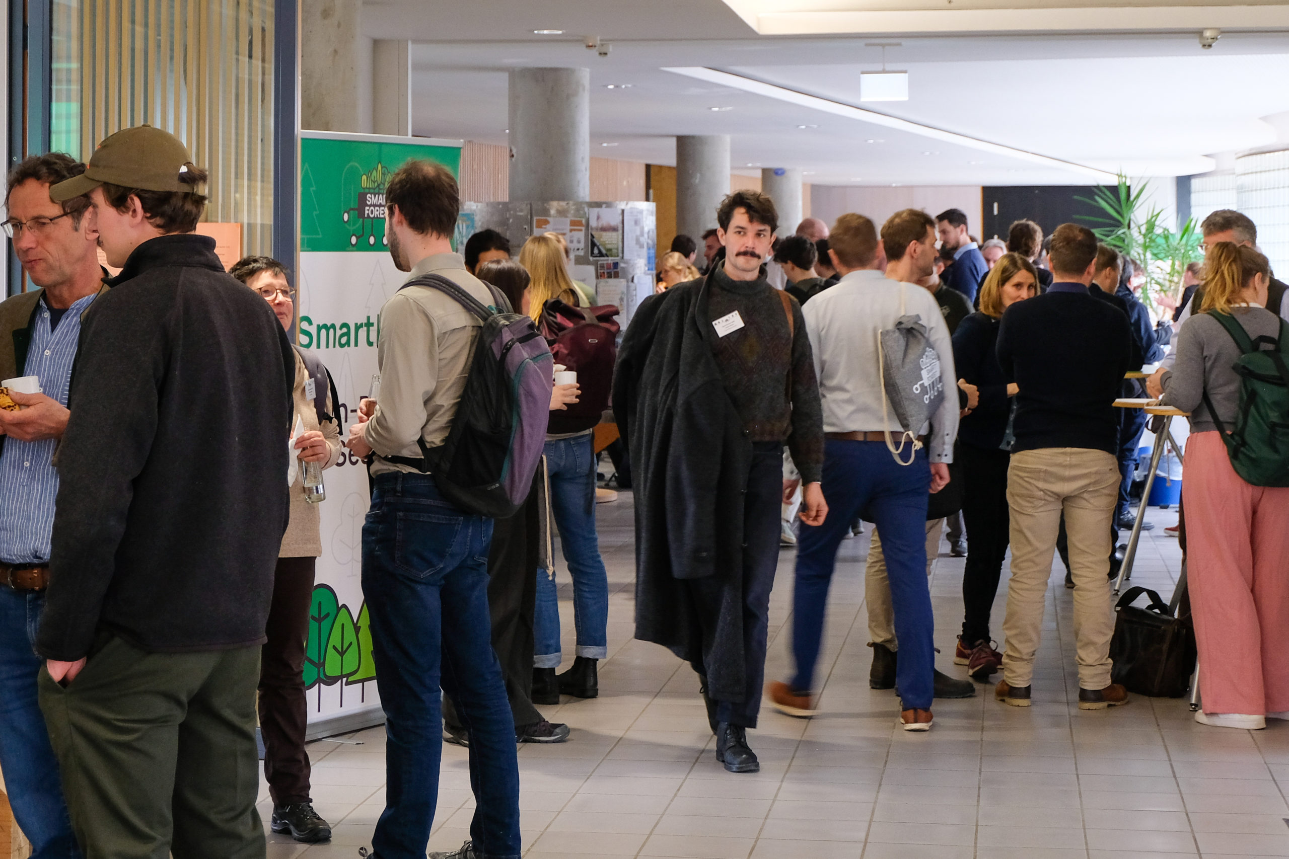 Participants make their way through the crowded foyer during one of the breaks at SmartForest 2026