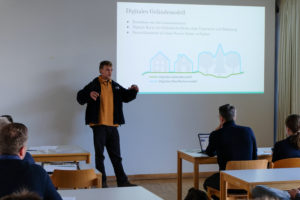 A presenter gestures as he addresses the crowd during an in-depth session at SmartForest 2026