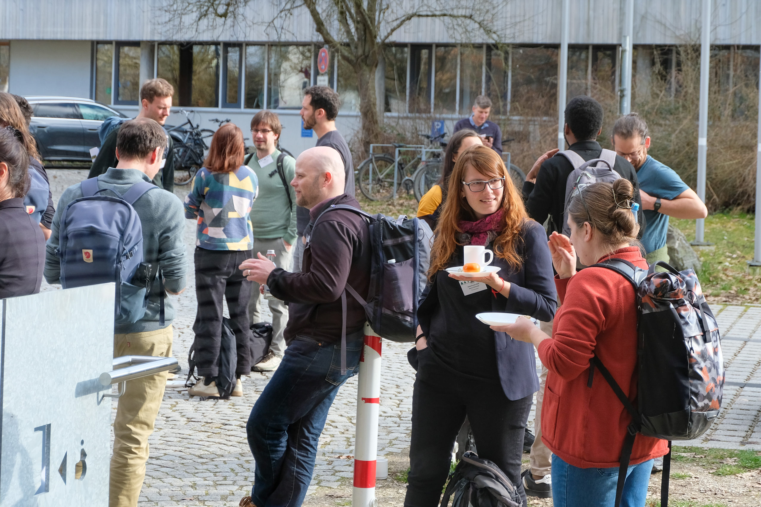 SmartForest 2026 participants have chats, drinks, and snacks outdoors during a conference break.