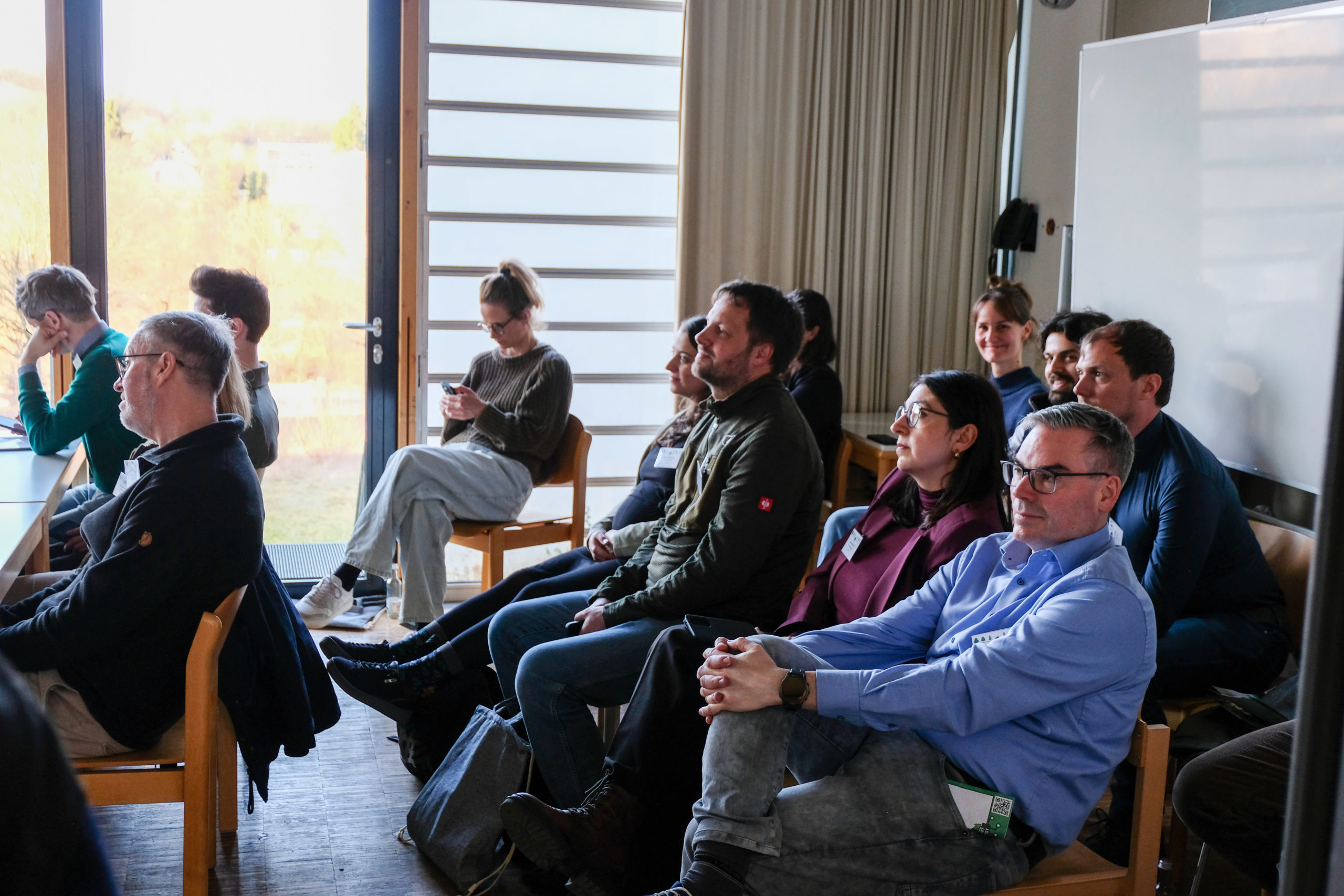 A crowd of people in a bright and sunny classroom during an in-depth session presentation at SmartForest 2026