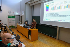 A speaker shows a large amount of graphs to the crowd at SmartForest 2026