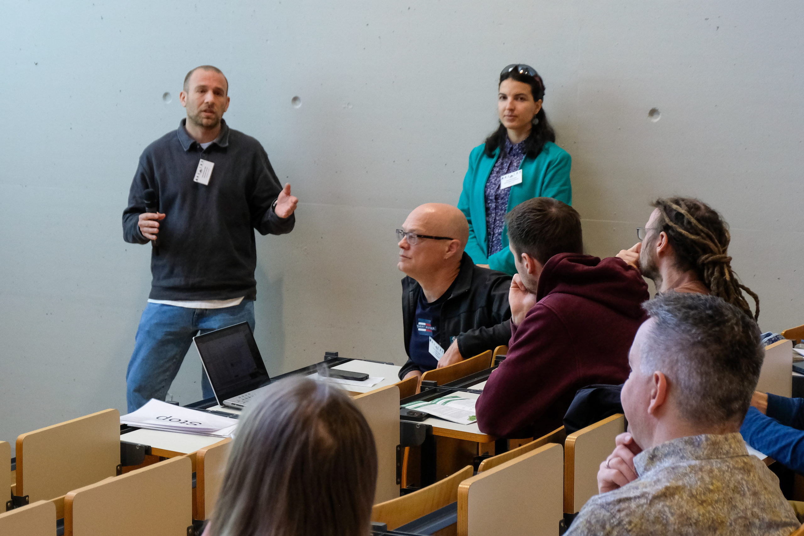 A speaker exchanges ideas with the crowd at SmartForest 2026 as the session moderator looks on.